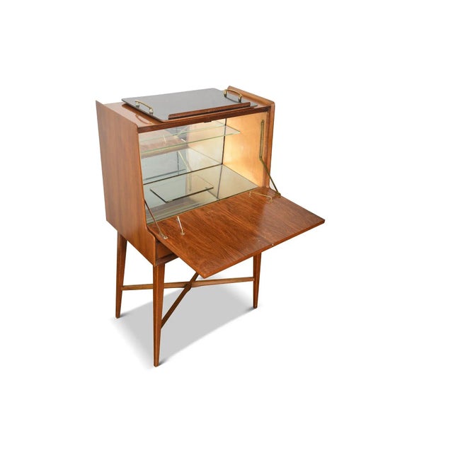 Origin: England Designer: Unknown Manufacturer: Wrighton Furniture Era: 1950s Materials: Afromosia Measurements: 30" wide...