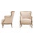 A handsome pair of French painted bergère chairs dating to circa 1900, featuring gracefully carved frames with serpentine...