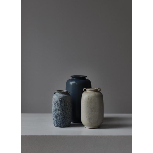 Beautiful stoneware vase in light glazing handmade by Arne Bang in Denmark the 1930s. Painted with signature "AB" to base....