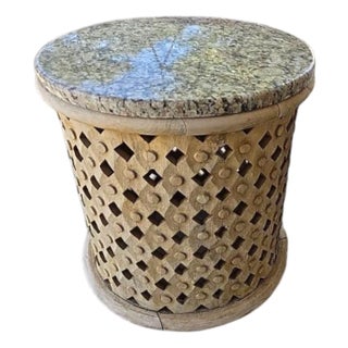 Hand Carved Wooden Drum Shaped Side Table With Lattice Detail and Granite Top For Sale