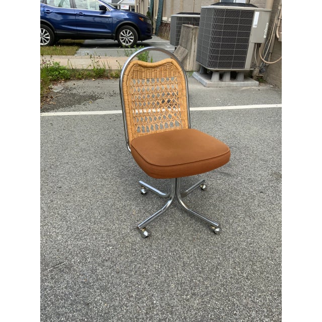 Lovely Wicker and Chrome Swivel Desk/Vanity Chair made by Daystrom Furniture Company. The upholstery is suede-like and in...