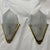 Elegant pair of decorative wall sconces featuring sculptural frosted glass shades set with gilt brass frames. Each molded...
