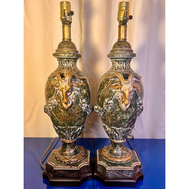 The Vintage Pair Rams Head Neoclassical Faux Marble & Bronze Lamps are a unique and stylish addition to any home. The...