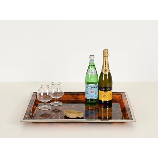 Marvelous Mid-Century serving tray fully made of vibrant tortoiseshell acrylic glass with a chrome frame. This incredibly...