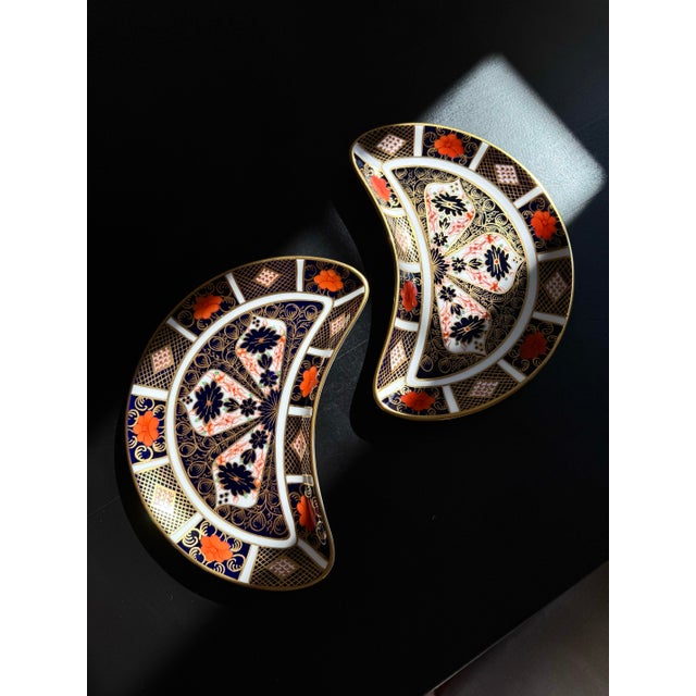 An exquisite Royal Crown Derby Old Imari 1128 crescent serving dish crafted in fine English bone china. This iconic...