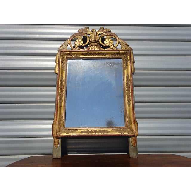 Very old mirror, 19th century, Louis XVI style. Original mercury mirror. Two-tone wood and stucco frame, painted in golden...