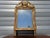 Very old mirror, 19th century, Louis XVI style. Original mercury mirror. Two-tone wood and stucco frame, painted in golden...