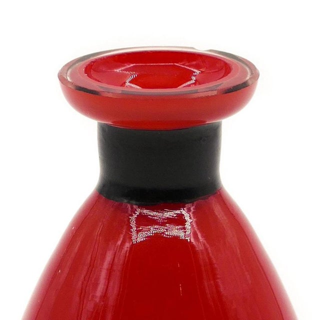 This Vintage Red Murano Glass Vase is a decorative object realized in Italy in the 1970's. Elegant small soliflore glass...