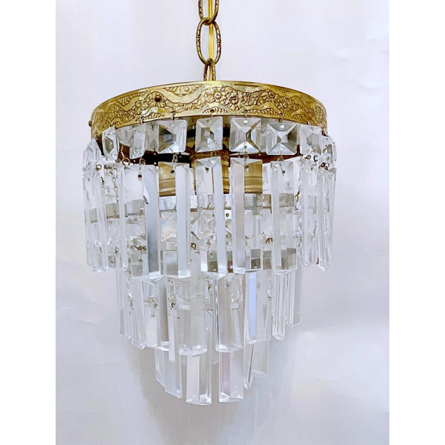 Italian upside down layered chandelier with bronze rim and vintage colonial cut crystal drops. Restored, rewired and it...