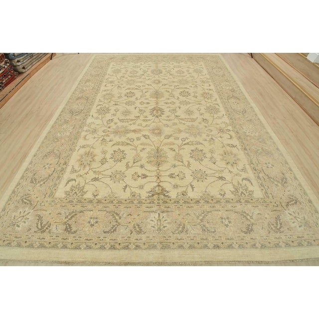 This modern traditional Ziegler rug is hand-knotted with an all-wool pile on a cotton foundation. This rug is new and in...