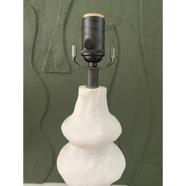 Quirky is good. This chic lamp could look good with any type of shade. Shade not included. Matte black full range dimmer...