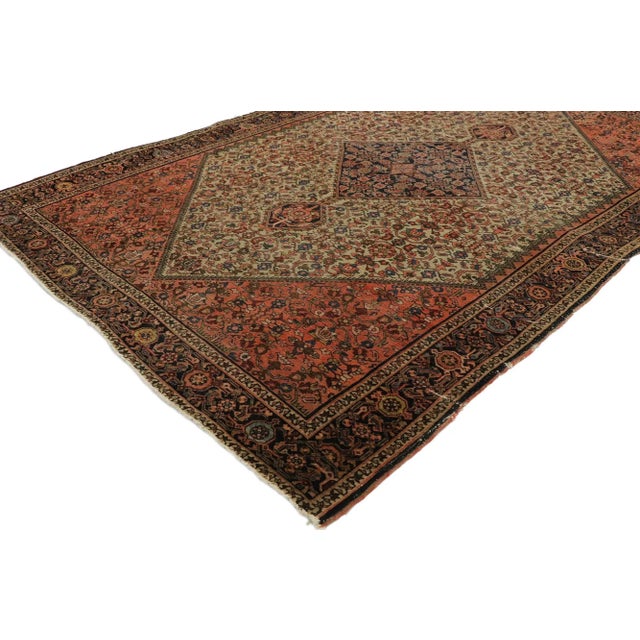 Distressed Antique Persian Farahan Rug withy Rustic Craftsman Style 04'02 x 06'04. With its geometric pattern and lovingly...