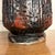 Pair Century Modern Pair of Lamps With Heavy Lava Glaze Textured. This pair of lamps features a ceramic body with black...