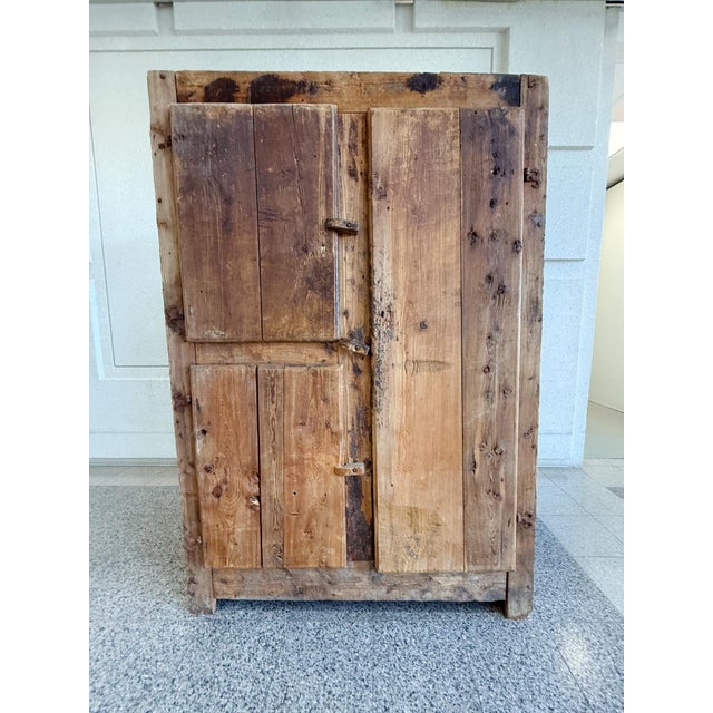 This rustic Danish cabinet was hand-crafted in the 19th Century. It is made from elmwood, a durable and sturdy wood. Here,...