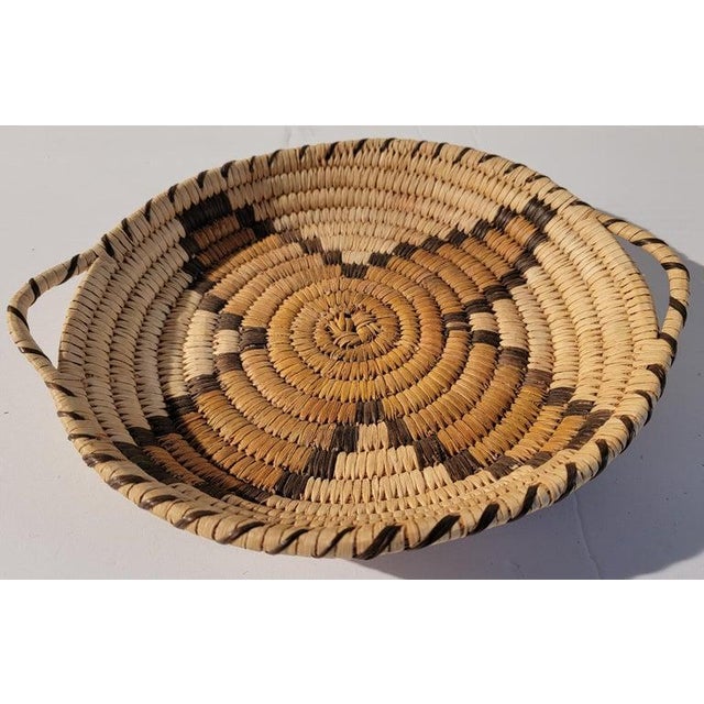 Star Pattern 20th C medium hand woven tray with handles. Wonderful color and great solid stable handle. Well made piece.