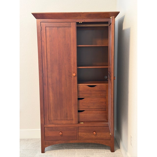 Ethan Allen American Impressions collection solid wood cherry finish, 2 door armoire with 1 fixed and 2 movable shelves, 4...