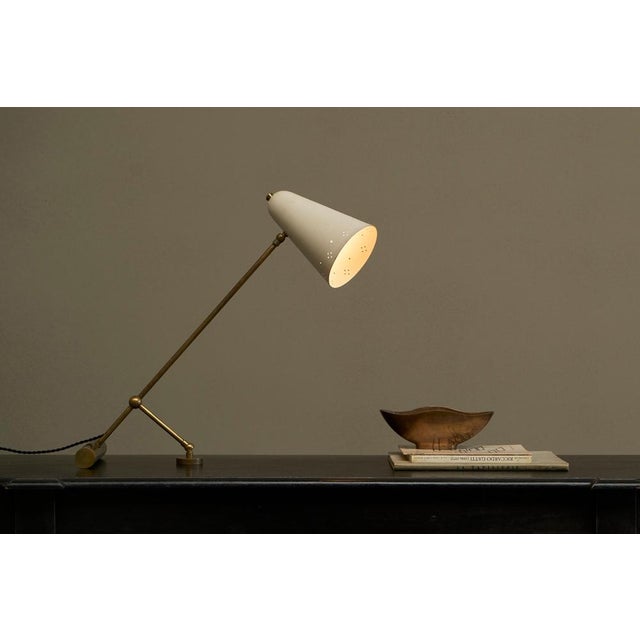 Adjustable Mid Century Table Lamp with Perforated Shade 1950s. A wonderful and very elegant 1950s table lamp with a nice...