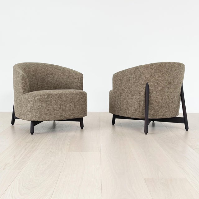 Set of two Copine Lounge Armchairs by Porada covered in a taupe fabric with stained walnut Canaletto feet.