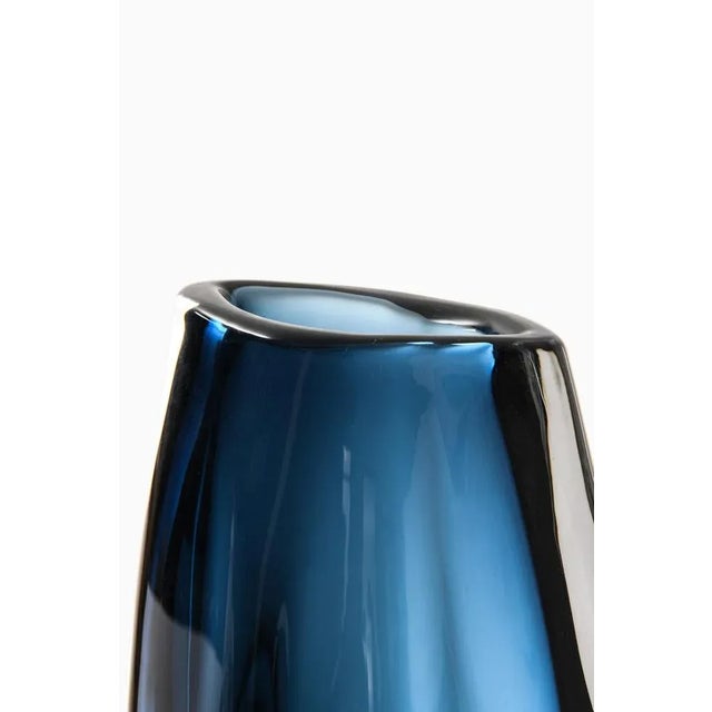 Rare and large glass vase designed by Nils Landberg. Produced by Orrefors in Sweden. Signed ‘Orrefors expo -63 Landberg’....