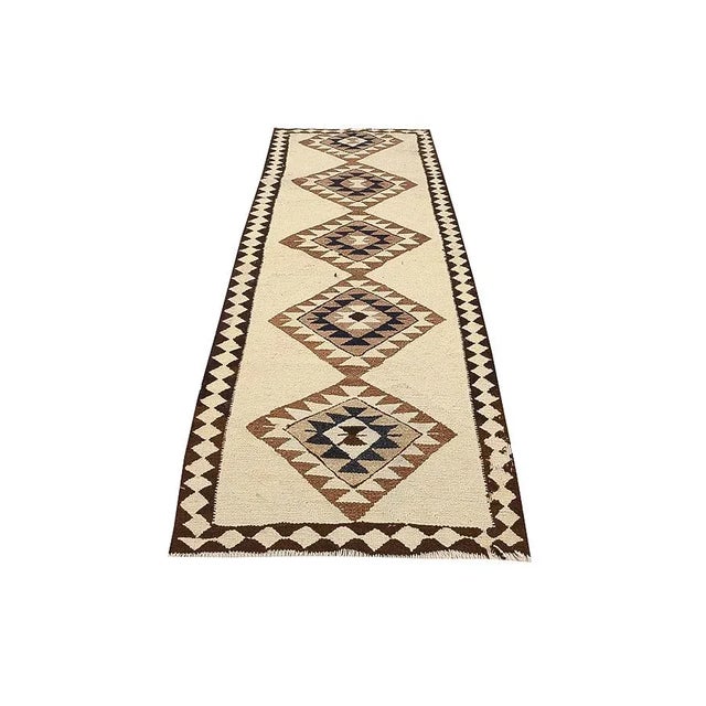 Decorative vintage handwoven Herki kilim runner rug. Approximately 45-55 years old. In very good condition.