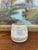 Hand-thrown studio pottery vessel signed by Freeburg, featuring a warm tan and ivory glaze with subtle variegation and...