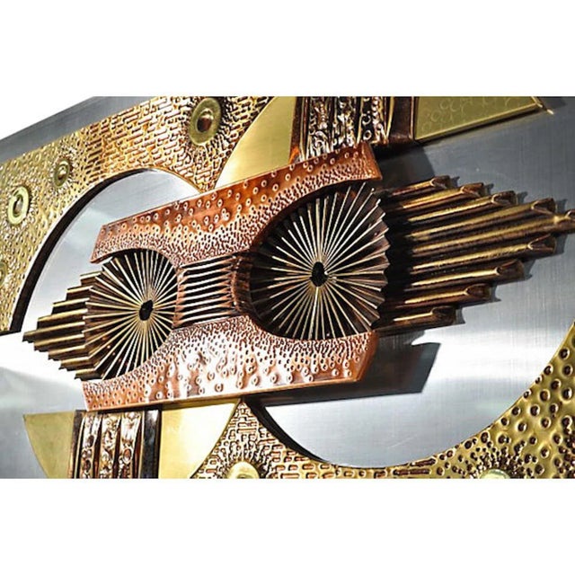 Vintage Brutalist metal wall sculpture with multiple sheet metal abstract shapes and forms composed together on an...