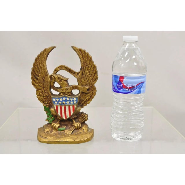 Antique Patriotic Cast Iron Figural Gold American Flag & Eagle Painted Door Stop. Circa Early 1900s. Measurements: 7" H x...