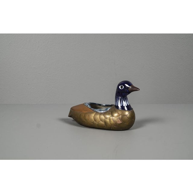 Egyptian duck with ceramic, brass and enamel bowl from the 1970s. The duck has a shell, the original patina has been...