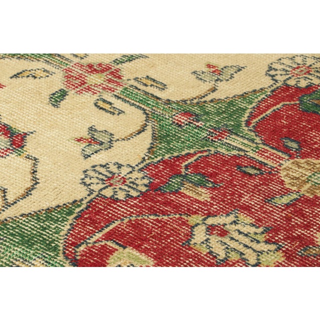 Hand-knotted in wool, this 2x6 vintage runner rug originating from Turkey, circa 1950-1960, is a very special piece,...