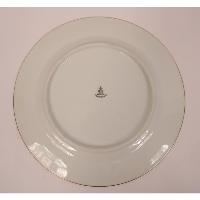 Set of 12 Heinrich & Co. porcelain dinner plates with acid etched 22 carat gold borders, circa 1960's. Diameter of plates...