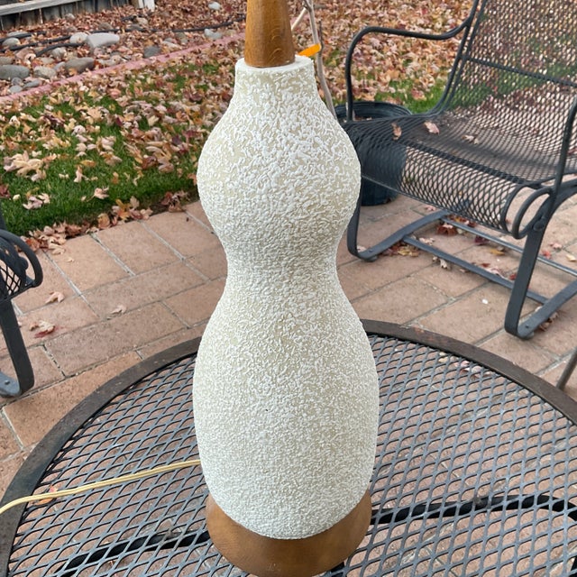 Mid Century Modern White Speckle Textured Lamp with Teak. This lamp dates to the 1950's and would look great in a Mid...