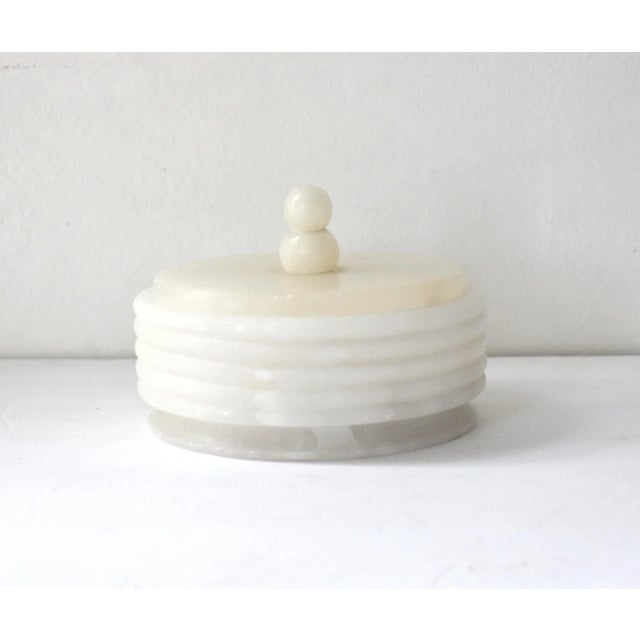 A vintage, mid-century Italian white alabaster (stone, marble) round lidded box, with grooved sides and a double knob...