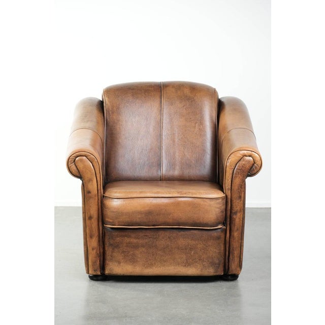 Beautifully designed and comfortable sheepskin armchair with a timeless look and a finish featuring matching piping. :...
