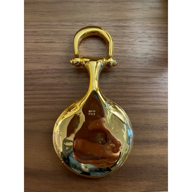 This is a vintage equestrian-themed Gucci trinket dish- classic, yet on trend. It is gold plated and marked Gucci and...