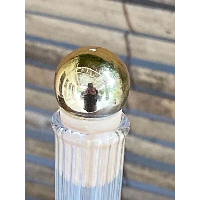 This vase is a perfume bottle, that can be used with the cap, as it, or as a vase if we put off the cap. The painting is...