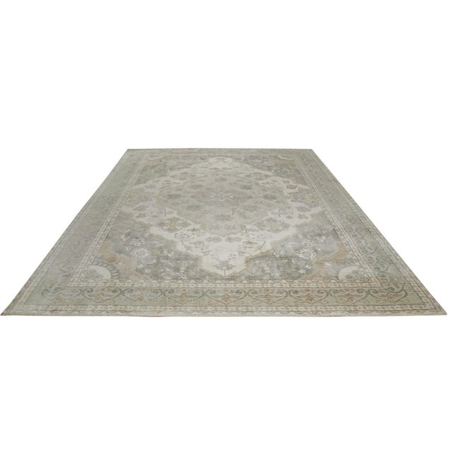Selene Oriental Green Handmade Wool Rug, Country of Origin: India. This exquisite piece presents a refined interpretation...
