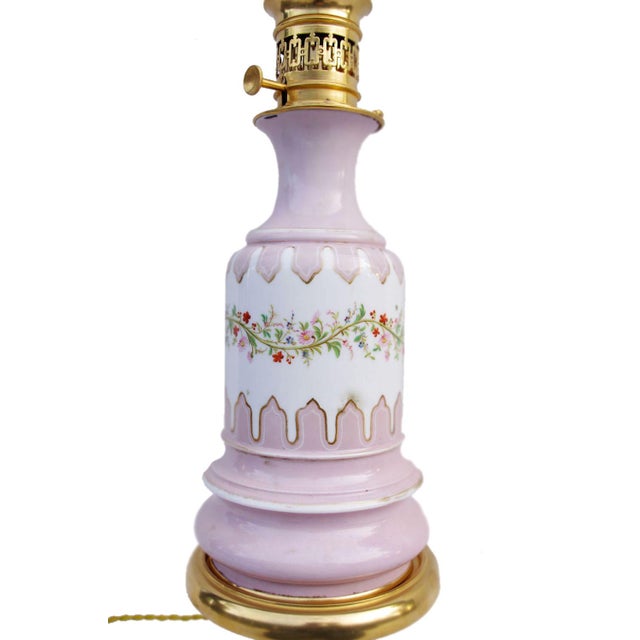Pair of Lilac colour Paris porcelain lamps standing on a piedouche shape base mounted in gilt bronze. The upper part of...
