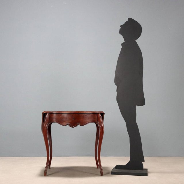 Louis Philippe mahogany coffee table. Drawer with curved front on the underside, side panels, and curved legs. France,...