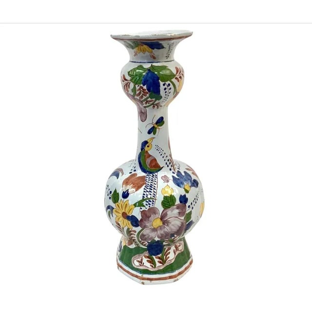 Large pair of hand painted Dutch Delft vases. Painted on the vases are birds, butterflies and florals in vivid colors of...