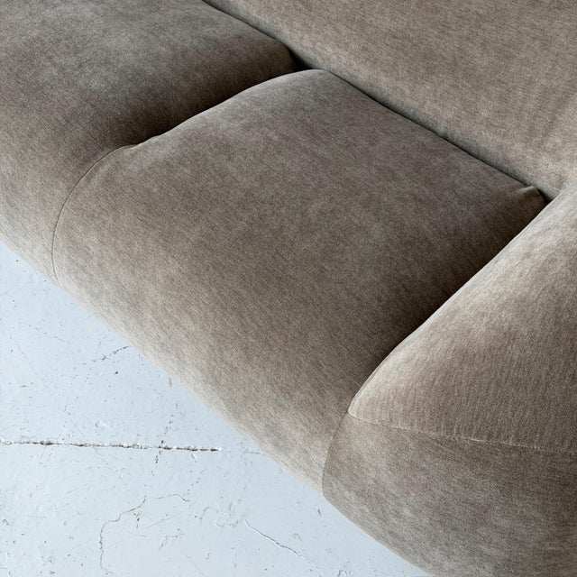 c. 1980s. USA. Reupholstered in grey/taupe mohair. This piece is attributed to the mentioned designer/maker. It has no...