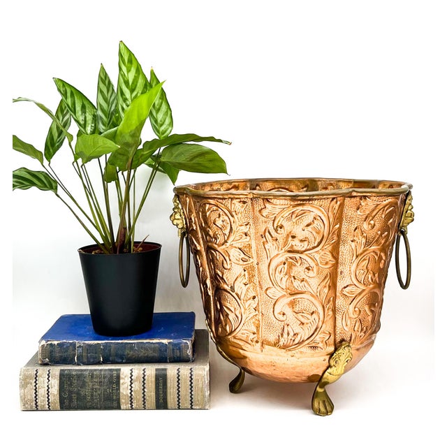 Stunning late 20th century copper planter featuring richly embossed scrolling foliage against a textured background. A...