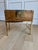 Elegant, versatile, and exceptionally well-crafted, this vintage campaign-style storage chest is by Baker Furniture and...