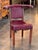 An English cock fighting chair, also referred to as a reading chair, the low mahogany frame designed to be sat astride,...