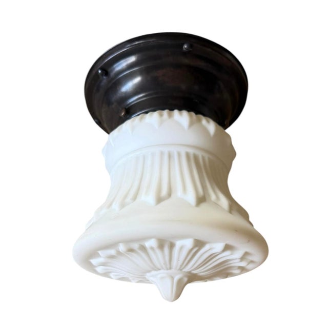 This is a charming early 1900’s art glass ceiling light fixture. Cast glass in a matte finish with great detail similar to...