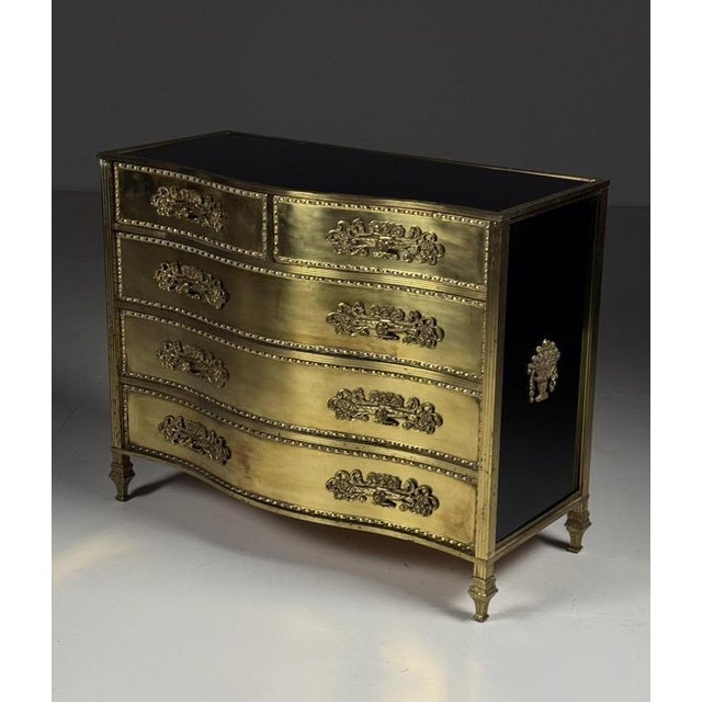 Gold-colored mid-century chest of drawers. Chest of drawers / commode. Originally from Italy, circa 1960. Hardwood base,...