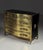 Gold-colored mid-century chest of drawers. Chest of drawers / commode. Originally from Italy, circa 1960. Hardwood base,...
