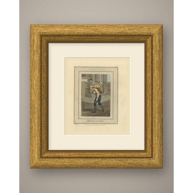 An original antique hand colored copper engraving of a london street seller, lettered "hotloaves." below the image and...