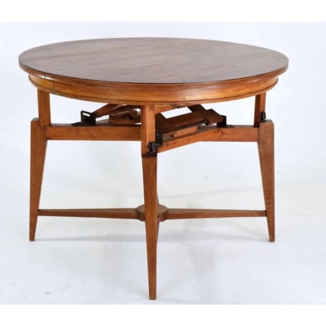 Marcel Gascoin, 1950s Dining table "goes up and down" convertible into wood, oak. . Diameter: 97 Low height 51 cm and high...