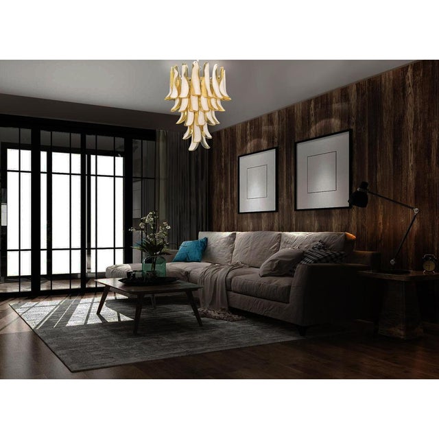 Italian Murano chandelier made by 52 glass petals (CARAMEL and white “lattimo”) in a chrome frame. Dimensions: 55,10...