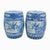A classic pair of blue and white chinoiserie porcelain garden stools, featuring traditional scenic motifs and decorative...